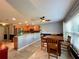 Eat-in kitchen with wood cabinets, tile floor, and breakfast bar at 16376 Sw 13Th Ter, Ocala, FL 34473