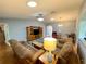 Spacious living room with hardwood floors, comfortable seating, and large windows at 16376 Sw 13Th Ter, Ocala, FL 34473