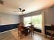 Bright dining area with wood table and chairs and large window at 16376 Sw 13Th Ter, Ocala, FL 34473