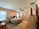 Spacious bedroom with king-size bed and wood floors at 16376 Sw 13Th Ter, Ocala, FL 34473