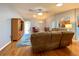 Bright living room with hardwood floors, ample seating, and ceiling fan at 16376 Sw 13Th Ter, Ocala, FL 34473