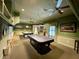 Community game room with two pool tables and a seating area at 16376 Sw 13Th Ter, Ocala, FL 34473