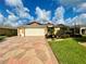 Two-story house with a two-car garage and landscaped yard at 16376 Sw 13Th Ter, Ocala, FL 34473