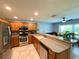 Updated kitchen featuring stainless steel appliances and granite countertops at 16376 Sw 13Th Ter, Ocala, FL 34473
