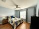 Bright bedroom featuring wood flooring and a ceiling fan at 16376 Sw 13Th Ter, Ocala, FL 34473