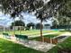 Outdoor shuffleboard courts with benches and shaded areas at 16376 Sw 13Th Ter, Ocala, FL 34473