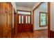 Inviting entryway featuring hardwood floors and a charming wood door at 7545 Ne 58Th Ave, Anthony, FL 32617