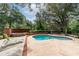 Inviting kidney-shaped pool with brick coping and spa at 7545 Ne 58Th Ave, Anthony, FL 32617