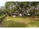 Large backyard with home view and wooden fence at 7545 Ne 58Th Ave, Anthony, FL 32617
