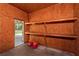 Workshop interior with shelves and exterior access at 7545 Ne 58Th Ave, Anthony, FL 32617