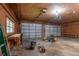 Garage interior with workshop and lawn equipment at 7545 Ne 58Th Ave, Anthony, FL 32617