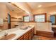 Double vanity bathroom with a large mirror and a jetted tub at 7545 Ne 58Th Ave, Anthony, FL 32617