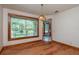 Bright dining room featuring hardwood floors and large windows at 7545 Ne 58Th Ave, Anthony, FL 32617