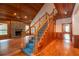 Wooden staircase with blue carpeting leading to the upper level at 7545 Ne 58Th Ave, Anthony, FL 32617