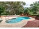 Refreshing kidney-shaped pool with brick and concrete at 7545 Ne 58Th Ave, Anthony, FL 32617