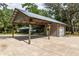 Covered carport next to detached garage at 7545 Ne 58Th Ave, Anthony, FL 32617