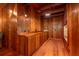 Wood paneled home office with built-in cabinetry and hardwood floors at 7545 Ne 58Th Ave, Anthony, FL 32617