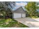 Two-car garage with concrete driveway and additional storage at 7545 Ne 58Th Ave, Anthony, FL 32617