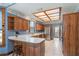 Spacious kitchen with wood cabinets and a breakfast bar at 7545 Ne 58Th Ave, Anthony, FL 32617