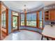 Bright kitchen nook with tiled floor and wood framed windows at 7545 Ne 58Th Ave, Anthony, FL 32617