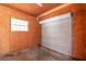 Workshop interior with roll-up door and storage at 7545 Ne 58Th Ave, Anthony, FL 32617