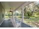 Spacious front porch with rocking chairs, overlooking a beautiful yard at 7545 Ne 58Th Ave, Anthony, FL 32617