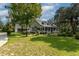 Two-story home with wraparound porch and large backyard at 7545 Ne 58Th Ave, Anthony, FL 32617