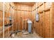 Mechanical room with water softener and storage shelves at 7545 Ne 58Th Ave, Anthony, FL 32617
