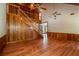 Two-story living room with hardwood floors, loft and staircase at 7545 Ne 58Th Ave, Anthony, FL 32617
