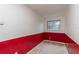 Small bedroom with a window and red and white walls at 7545 Ne 58Th Ave, Anthony, FL 32617