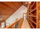 Upper hallway with built-in shelves and wood railing at 7545 Ne 58Th Ave, Anthony, FL 32617