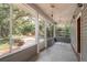 Peaceful screened porch overlooking the pool and backyard at 7545 Ne 58Th Ave, Anthony, FL 32617