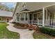 Side porch with brick steps and walkway leading to home at 7545 Ne 58Th Ave, Anthony, FL 32617
