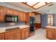 Modern kitchen with stainless steel appliances and wood cabinets at 7545 Ne 58Th Ave, Anthony, FL 32617