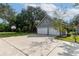 Two-car garage with basketball court and additional storage at 7545 Ne 58Th Ave, Anthony, FL 32617