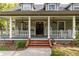 Front porch with white railings and double doors at 7545 Ne 58Th Ave, Anthony, FL 32617