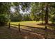 Spacious backyard with wooden fence and lush trees at 7545 Ne 58Th Ave, Anthony, FL 32617