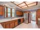 Well-equipped kitchen featuring wood cabinets and stainless steel appliances at 7545 Ne 58Th Ave, Anthony, FL 32617