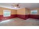 Spacious bedroom with two windows and ceiling fan at 7545 Ne 58Th Ave, Anthony, FL 32617