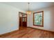 Spacious dining area with hardwood floors and a view to the entryway at 7545 Ne 58Th Ave, Anthony, FL 32617