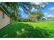 Spacious backyard with shed and large tree at 5311 Se 15Th Ct, Ocala, FL 34480