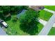 Aerial view of house and surrounding property with large trees at 5311 Se 15Th Ct, Ocala, FL 34480