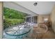 Enjoy outdoor dining on this screened porch at 5311 Se 15Th Ct, Ocala, FL 34480