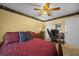 Well-lit bedroom with a full-size bed and ample closet space at 5311 Se 15Th Ct, Ocala, FL 34480