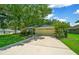 Tan house with a two car garage and a neatly kept lawn at 5311 Se 15Th Ct, Ocala, FL 34480