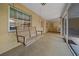 Screened porch features hanging swing at 5311 Se 15Th Ct, Ocala, FL 34480