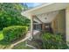 Outdoor seating area with screened porch and landscaping at 5311 Se 15Th Ct, Ocala, FL 34480
