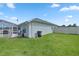 Spacious backyard with screened patio, shed, and fenced yard at 3967 Se 99Th St, Belleview, FL 34420