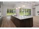 Gourmet kitchen boasts a large island, stainless steel appliances, and ample counter space at 7578 Nw 33Rd Pl, Ocala, FL 34482