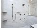 Walk-in shower with multiple shower heads and marble surround at 7578 Nw 33Rd Pl, Ocala, FL 34482